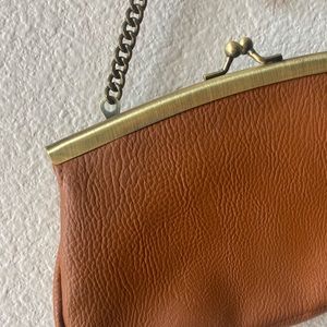Brown leather clutch